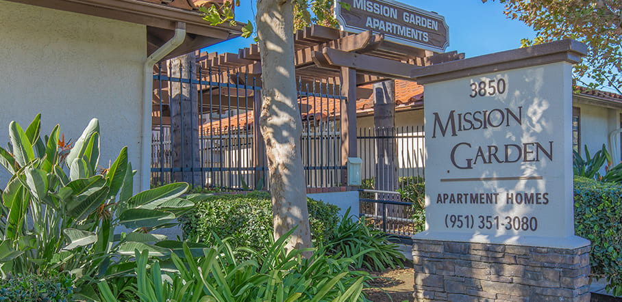 Monument sign for the apartment complex, Mission Garden Apartments
